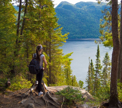 Woman gazing at Canadian wilderness.